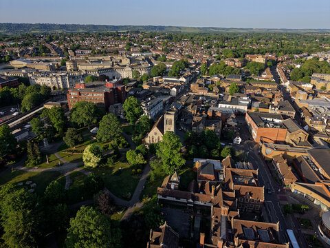 Brenchley Gardens with Anglican church in Maidstone, Kent, UK. Aerial view towards Maidstone East town at golden hour.