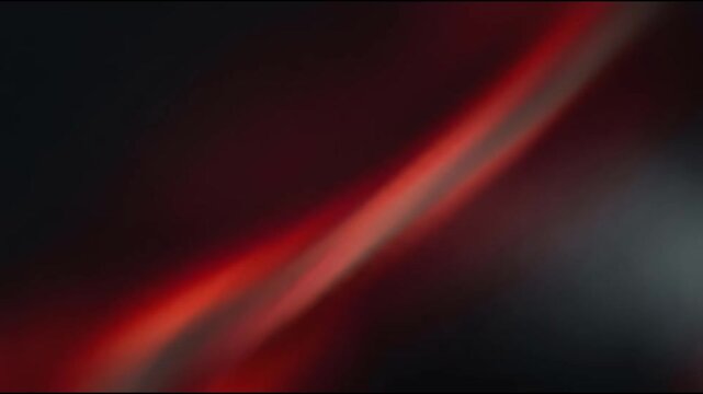 Abstract dark moody background with vibrant red neon light streak and grainy cinematic texture

