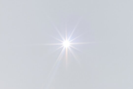 The Sun Burst Over Minimalist Sky with Radiant Starflare and Bright Light