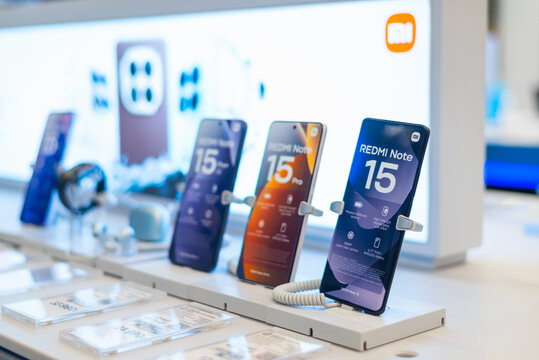 Smolensk, Russia 08.05.2026. Xiaomi smartphones are displayed in a tech store, highlighting the features of the Redmi Note 15 series.