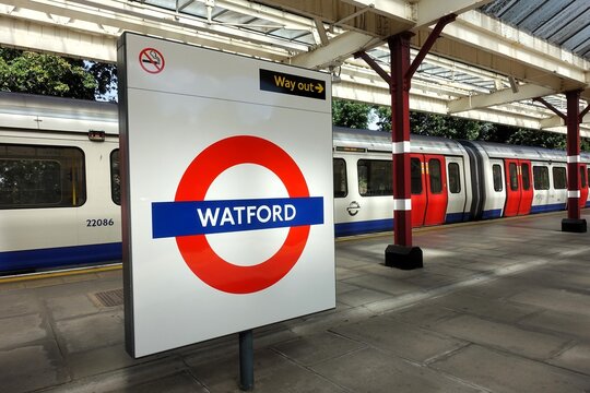 A classic London Underground roundel sign on the platform at Watford tube station, which serves as the northern terminus of the Metropolitan line in Hertfordshire