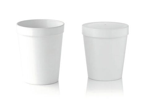 Minimalist white cylindrical storage containers set.