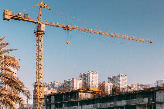 Construction Crane Is Involved In Development Of A New Multi-storey Residential Building