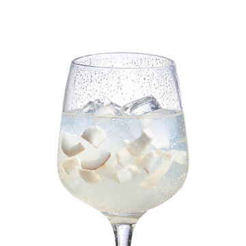 Cold drink with condensation on glass filled with ice and coconut pieces isolated on transparent background png