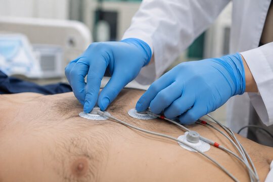 healthcare photo of a medical professional placing ECG electrodes on a patient's chest area, modern diagnostic room, clean medical atmosphere