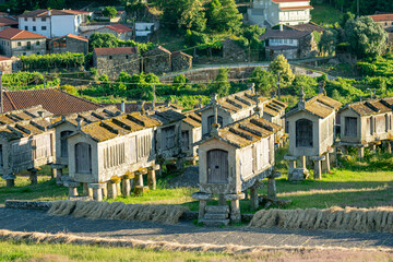 Fototapeta premium Lindoso traditional stone granaries in a rural village The Concept of heritage and agriculture