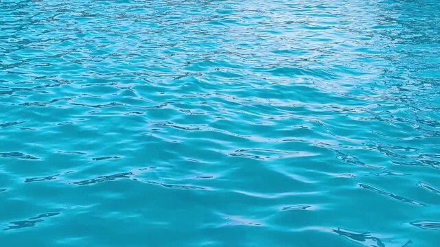 Clean Blue Swimming Pool Water Ripple Surface. 4K Motion Background with Copy Space