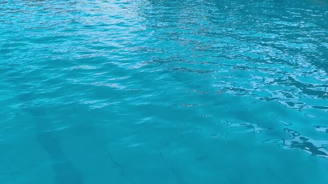 Clean Blue Swimming Pool Water Ripple Surface. 4K Motion Background with Copy Space