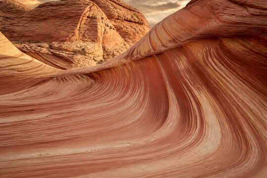 Eroded sandstone waves forming layered patterns in desert