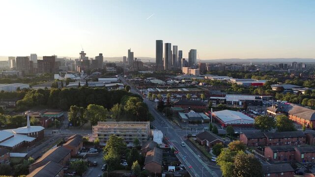 Aerial view of Manchester city skyscrapers during the golden hour sunset light
