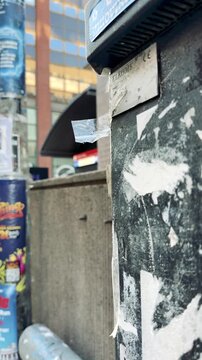 Torn Street Posters on Urban Wall Texture Vertical Video