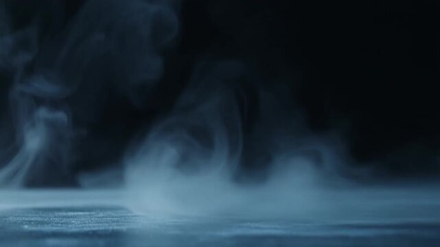 mist disperses and thins across dark surface, soft wisps fading gradually under cool backlighting with ethereal atmosphere, subtle glow, and minimalist cinematic motion.