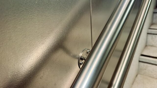 Brushed Metal Handrail Detail at Metro Station Close-up