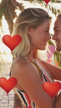 Animation of heart icons over couple in love on beach