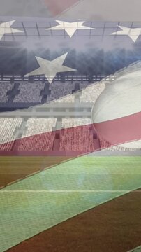 Waving american flag over multiple rugby balls falling against sports stadium