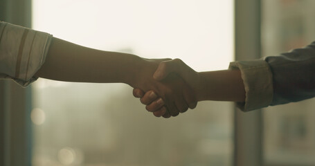 Handshake, office and business women for agreement, partnership and real estate negotiation. Realtor, meeting and people shaking hands for property investment, commercial deal and client greeting © peopleimages.com