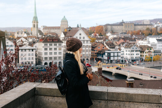 Young Female Tourist Enjoying Panoramic View of Zurich City Center in Autumn, Switzerland
