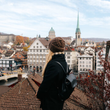 Young Female Tourist Enjoying Panoramic View of Zurich City Center in Autumn, Switzerland