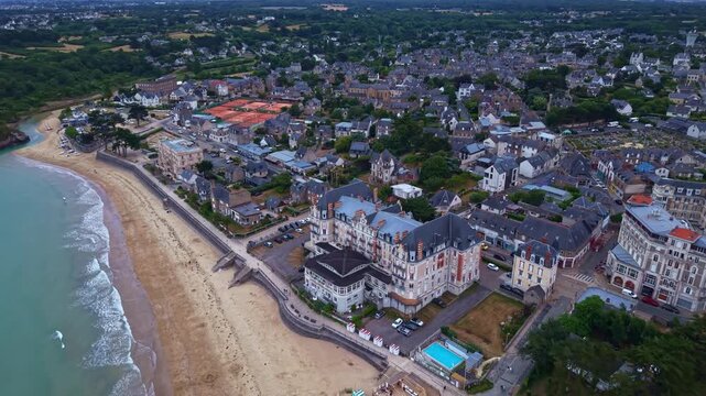 Saint-Lunaire waterfront with the Grand Hotel, Longchamp Beach, Saint-Lunaire, Ille-et-Vilaine, Brittany, France, English Channel, Emerald Coast, drone pullout.