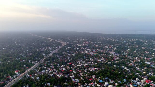 The drone footage captures the peaceful charm of Kerala's famous backwater city during the evening. cinematic aerial highlights the city's unique blend of greenery and modern development.