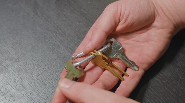 Looking through a ring of keys for the correct one.