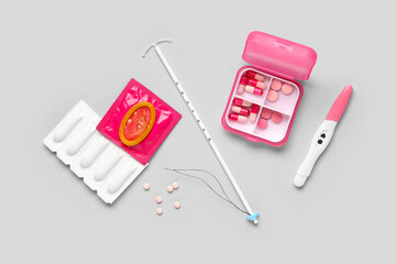 Contraception methods and pregnancy test kit for family planning and reproductive health on a gray...