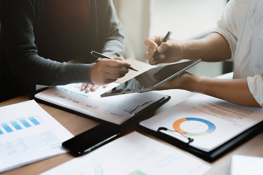 Accountant reviewing numbers in office documents for valuation clarity