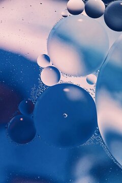 Abstract macro background with oil bubbles floating on water surface