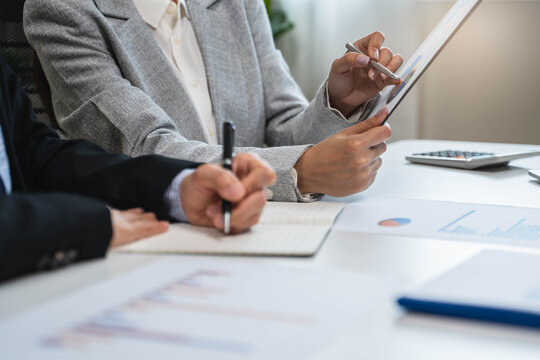Financial consult planning investor asses and present to client, Close up shot client and advisor review investment strategy in the office.