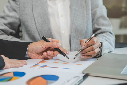 Financial consult planning investor asses and present to client, Close up shot client and advisor review investment strategy in the office.