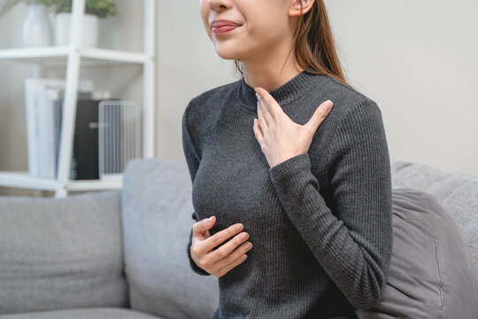 Women feeling pain in her chest from reflux acid