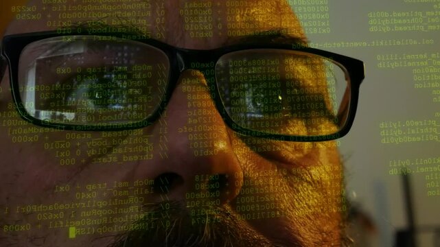 Man wearing glasses watching lines of digital code and data scanning displayed on front of his face