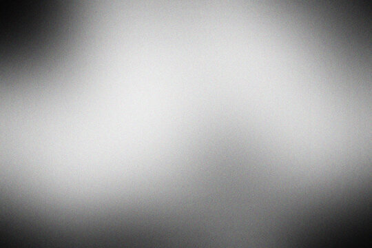 Black and Gray Abstract Gradient Background with Fine Grain Noise, Soft Spotlight Vignette and Distressed Texture for Wallpaper, Poster, Web Banner and Graphic Design