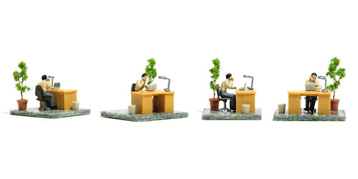 Miniature tiny people toy figure photography. Workspace station layout design concept. A businessmen seat on his desk, working his job while make a phone call. Isolated on a white background