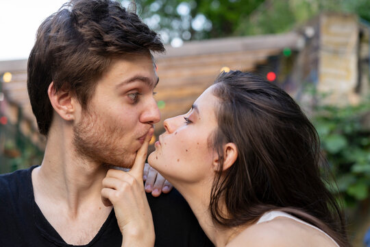 Portrait of young couple facing each other