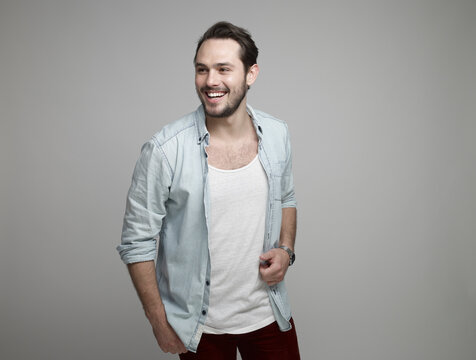 Young man looking away, smiling