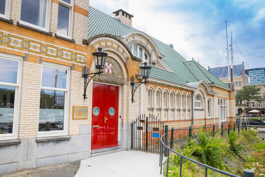 Red Door of the historic clubhouse in the Veerhaven harbor of Rotterdam, Netherlands