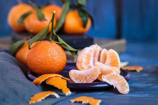 Clementines on plate, peeled