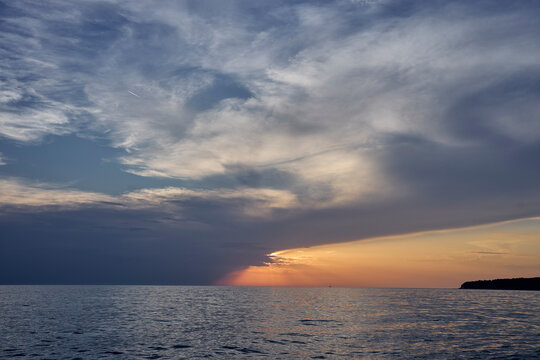 Dramatic sunset over the Adriatic Sea with clouds in Croatia