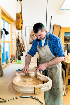Guitar maker in his workshop
