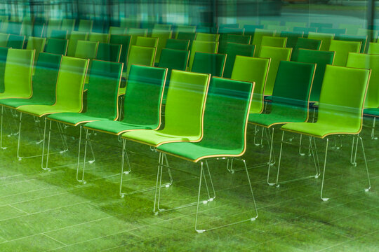 Chairs in a conference room, seeing through glass pane