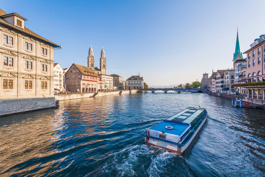 Switzerland, Zurich, view of city with tourboat on Limmat in the foreground
