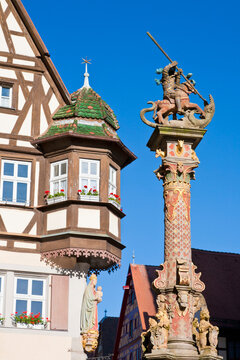 Georgsbrunnen fountain stands in Rothenburg ob der Tauber
