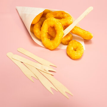 Fried calamari-rings in paper bag, close-up