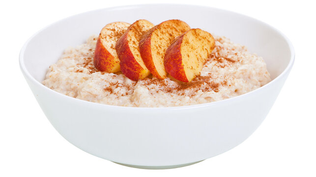 Creamy oatmeal topped with sliced red apples and cinnamon, isolated on transparent background