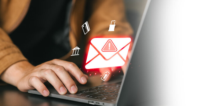 Person typing on laptop with email alert and security icons overlay, close-up