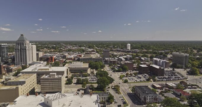 Greensboro North Carolina Aerial v22 orbiting flyover around downtown towers, civic buildings and city blocks - Shot with Mavic 3 Pro Cine - Oct 1st 2023