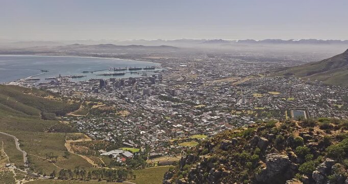 Cape Town South Africa Aerial v39 reverse flyover from Lion's Head summit across Signal Hill toward Downtown, Foreshore, Sea Point and Table Bay - Shot with Mavic 3 Pro Cine - Jan 11th 2024