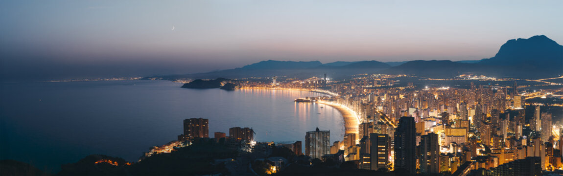 Panoramic Aerial View of Benidorm City Skyline and Coastline at Twilight, Spain