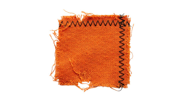 Frayed orange fabric patch with black zigzag stitching isolated on transparent background